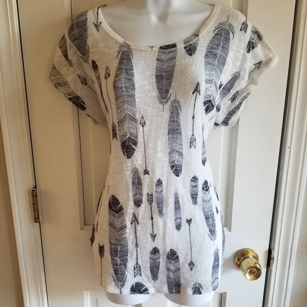 Feather and arrow print knit top